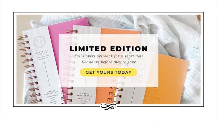 Three Everyday Mother baby tracking journals with limited edition fall covers are displayed. The journals have gold spiral bindings and are available in pink, orange, and mustard colors. The covers feature the Everyday Mother logo and the text 'baby tracking made beautifully easy.' An overlay text reads 'Limited edition fall covers are back! Shop now,' promoting the seasonal collection.