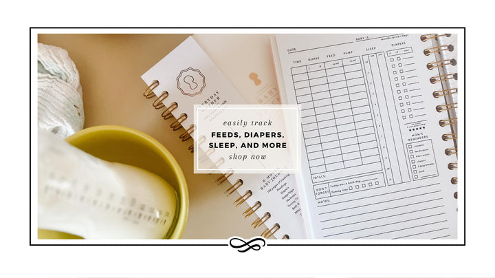 An overhead view of an open Everyday Mother baby tracking log book laying on top of a closed Everyday Mother book, next to a glass baby bottle resting in a yellow bowl. Text on top of the photo says "easily track feeds, diapers, sleep, and more. Shop now".
